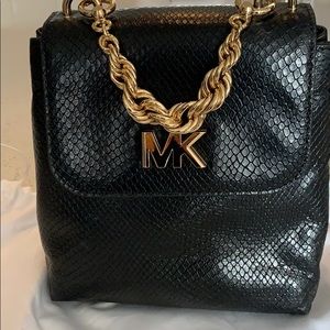 Micheal Kors mini backpack in embossed leather